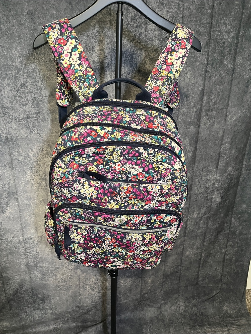 Vera Bradley Navy Floral Quilted Backpack with Pink & Yellow Accents has a tear